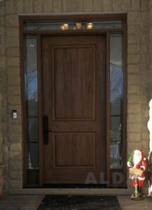 Brown fiberglass door with two sidelites.