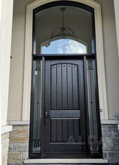 A black fiberglass door with round glass above