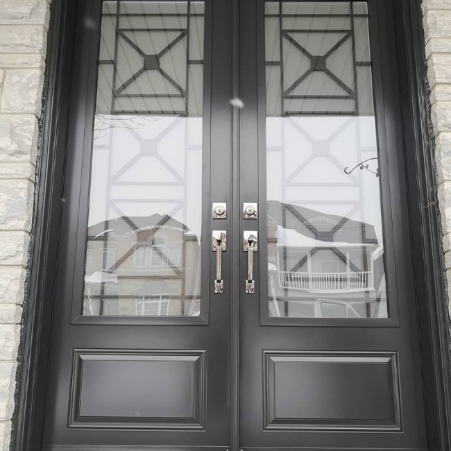 Image depicts a black double entry door.