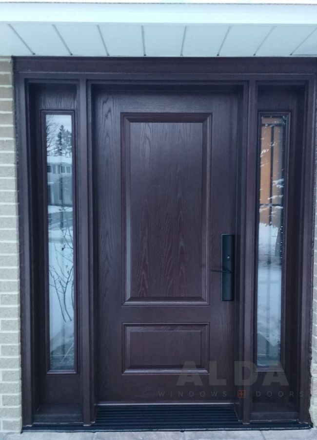 A black fiberglass door with two decorative sidelites.
