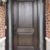 A brown fiberglass entry door.
