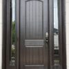 A brown fiberglass entry door with two sidelights