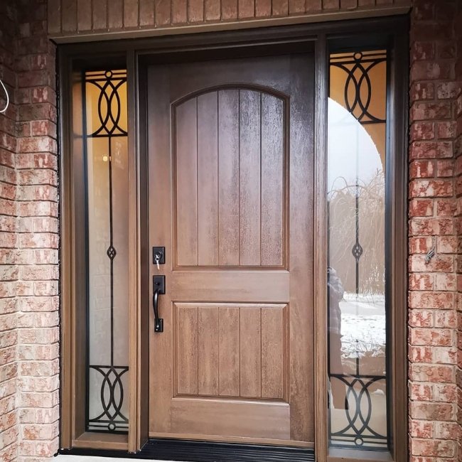 Image depicts a brown fiberglass entry door.