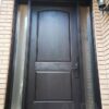 A black fiberglass door with two sidelites.