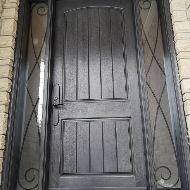Dark fiberglass entry door with sidelites.