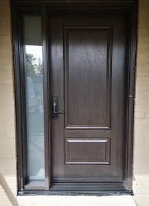 A wood-style fiberglass door with two sidelites.