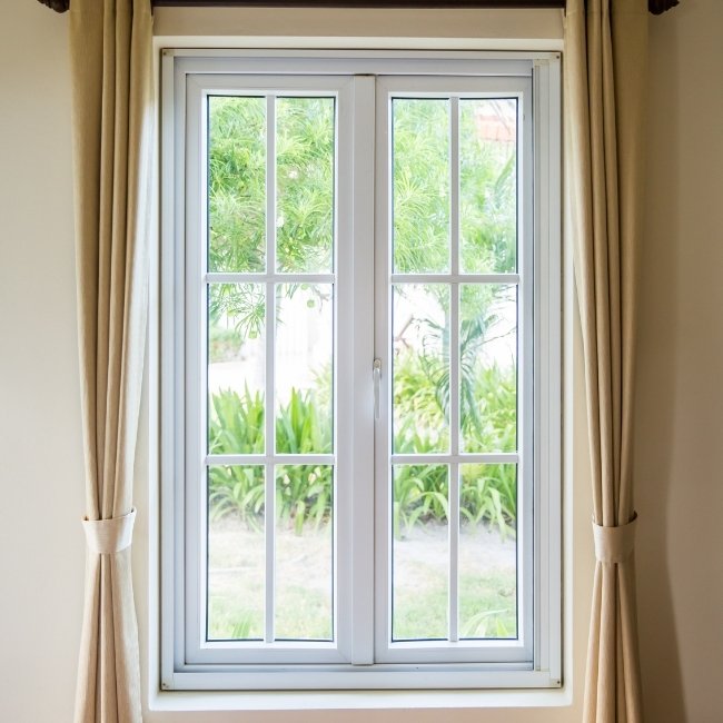 Image depicts a new white casement window.