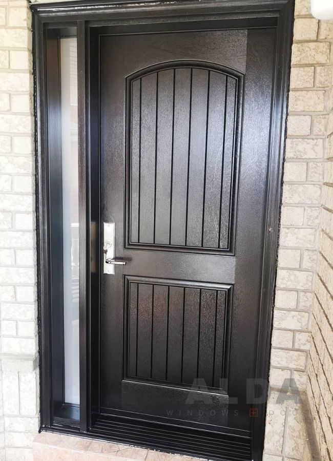 A dark brown fiberglass entry door with a decorative glass insert.