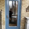 Traditional light blue steel door