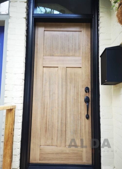 A yellow wood style fiberglass door