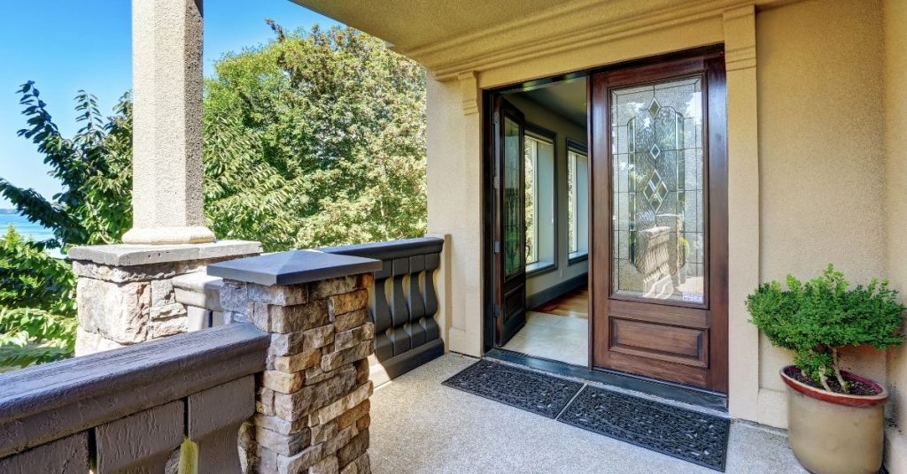 Home with an entry door that adds value to the home.