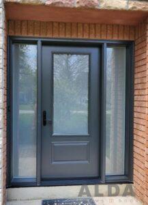 Gray steel door with large sidelights