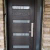 solid-fiberglass-door-with-frosted-glass-panels-and-a-sidelight