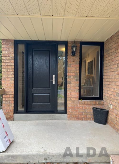 Black entry door with two sidelights