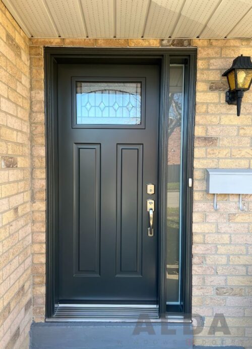 Black front door with glass insert and sidelight