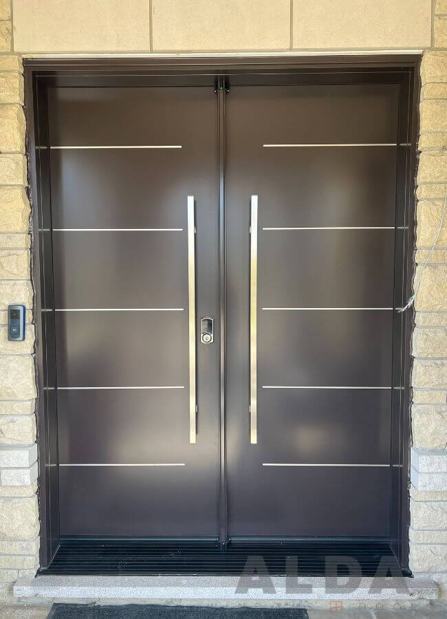 Brown front door with aluminum inserts