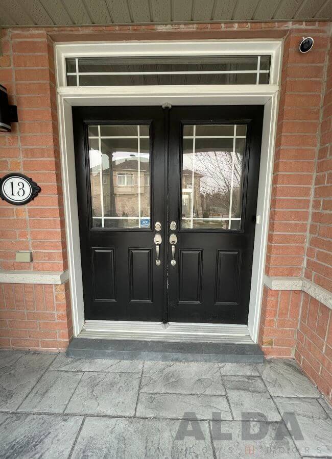 Black front door with white frame