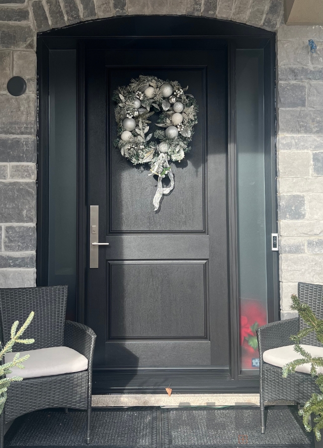 Black front door with two frosted sidelites