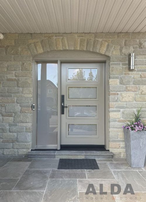 Dark cream front door with sidelight and glass inserts