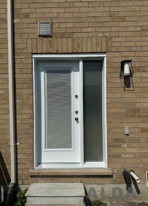 White front door with internal blinds and frosted sidelight