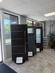 alda showroom black entry door display by window